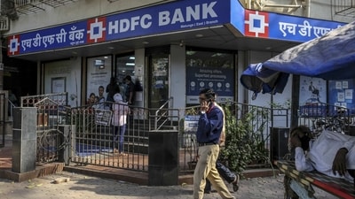 Bank holiday for Eid 2025: Pedestrian walk past an HDFC Bank Ltd. branch in Mumbai, India, (Bloomberg) Bank holiday for Eid 2025: Pedestrian walk past an HDFC Bank Ltd. branch in Mumbai, India, (Bloomberg)