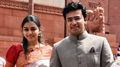 Bharatiya Janata Party (BJP) MP Tejasvi Surya with his wife Sivasri Skandaprasad outside Parliament House. (Shrikant Singh/PTI)