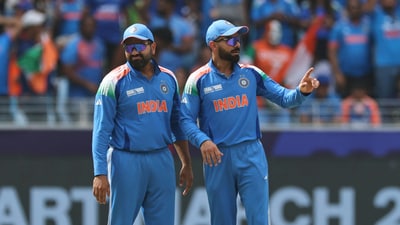 India's Virat Kohli, right, and captain Rohit Sharma (AP)
