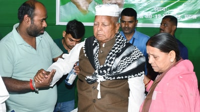 Rashtriya Janata Dal (RJD) Chief Lalu Prasad Yadav, party leader Rabri Devi, and party supporters during an Iftar party organised by RJD in Patna. ((ANI Photo)) Rashtriya Janata Dal (RJD) Chief Lalu Prasad Yadav, party leader Rabri Devi, and party supporters during an Iftar party organised by RJD in Patna. ((ANI Photo))