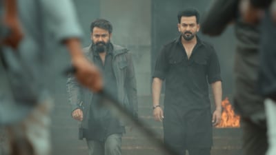 L2 Empuraan Twitter reviews: Mohanlal and Prithviraj Sukumaran in a still from the film.