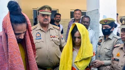 Police take away Merchant Navy officer Saurabh Rajput's wife Muskan and her lover Sahil Shukla after they were arrested in connection with his murder. (PTI)