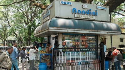 Customers at a Nandini milk shop in Bengaluru. (PTI File) Customers at a Nandini milk shop in Bengaluru. (PTI File)