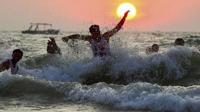 North Goa: Tourists enjoy at the Arabian Sea as the sun sets at Calangute Beach in North Goa. (PTI FILE PHOTO) North Goa: Tourists enjoy at the Arabian Sea as the sun sets at Calangute Beach in North Goa. (PTI FILE PHOTO)
