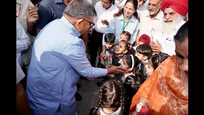 Punjab governor Gulab Chand Kataria interacting with children during the Jan Yatra against drugs in Kharar on Thursday. (HT Photo)