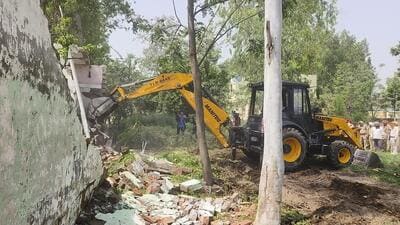 The Hoshiarpur police in association with the district administration on Thursday demolished an illegal building constructed on encroached land of a woman drug peddler at village Nainowal Vaid. The Hoshiarpur police in association with the district administration on Thursday demolished an illegal building constructed on encroached land of a woman drug peddler at village Nainowal Vaid.
