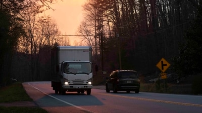 PUMPKINTOWN, SOUTH CAROLINA - MARCH 26: Motorists travel along a road as smoke from the Table Rock Complex fire clouds the sun on March 26, 2025 in Pumpkintown, South Carolina. Drought-like conditions and high winds are fueling multiple wildfires that have triggered evacuations across northern South Carolina (Photo by Sean Rayford / GETTY IMAGES NORTH AMERICA / Getty Images via AFP) (Getty Images via AFP) PUMPKINTOWN, SOUTH CAROLINA - MARCH 26: Motorists travel along a road as smoke from the Table Rock Complex fire clouds the sun on March 26, 2025 in Pumpkintown, South Carolina. Drought-like conditions and high winds are fueling multiple wildfires that have triggered evacuations across northern South Carolina (Photo by Sean Rayford / GETTY IMAGES NORTH AMERICA / Getty Images via AFP) (Getty Images via AFP)