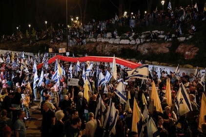 Anti-government demonstrators raise flags and placards as they protest outside the Israeli parliament in Jerusalem on March 26, 2025, calling for an end to the war in Gaza, the return of all the hostages held by Hamas and against the judicial reform project. (AFP) Anti-government demonstrators raise flags and placards as they protest outside the Israeli parliament in Jerusalem on March 26, 2025, calling for an end to the war in Gaza, the return of all the hostages held by Hamas and against the judicial reform project. (AFP)