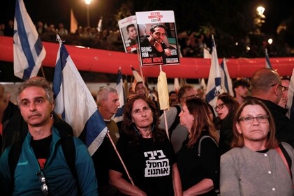 Anti-government demonstrators carry pictures of Israeli hostages during a protest outside the Israeli parliament in Jerusalem on March 26, 2025, calling for an end to the war in Gaza, the return of all the hostages held by Hamas and against the judicial reform project. (AFP) Anti-government demonstrators carry pictures of Israeli hostages during a protest outside the Israeli parliament in Jerusalem on March 26, 2025, calling for an end to the war in Gaza, the return of all the hostages held by Hamas and against the judicial reform project. (AFP)