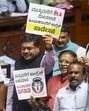 Assembly members hold placards during a protest to demand a judicial probe into the alleged ‘honey-trap’ attempt on March 21. (PTI) Assembly members hold placards during a protest to demand a judicial probe into the alleged ‘honey-trap’ attempt on March 21. (PTI)