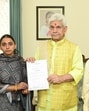 J&K Lieutenant Governor Manoj Sinha, on Thursday, handed over the appointment letter, on compassionate ground, to Renu Sharma, sister of Arjun Sharma, who was killed in Reasi terror attack on June 9 last year. (HT Photo) J&K Lieutenant Governor Manoj Sinha, on Thursday, handed over the appointment letter, on compassionate ground, to Renu Sharma, sister of Arjun Sharma, who was killed in Reasi terror attack on June 9 last year. (HT Photo)