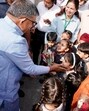 Punjab governor Gulab Chand Kataria interacting with children during the Jan Yatra against drugs in Kharar on Thursday. (HT Photo)
