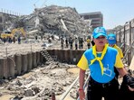 Thai King's volunteers work near the site of a collapsed building after a strong earthquake struck central Myanmar on Friday, earthquake monitoring services said, which affected Bangkok as well with hundreds of people pouring out of buildings in the Thai capital in panic after the tremors, in Bangkok, Thailand, March 28, 2025.