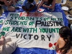 Students at Columbia University paint a response to a message written by Palestinians in Rafah thanking students for their support as they continue to maintain a protest encampment on campus in support of Palestinians, during the ongoing conflict between Israel and the Palestinian Islamist group Hamas, in New York City, U.S., April 28, 2024. 