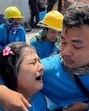 Workers react while sitting on ground after a strong earthquake struck central Myanmar on Friday. (AP photo) Workers react while sitting on ground after a strong earthquake struck central Myanmar on Friday. (AP photo)