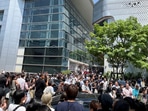 People gather on the street, after the tremors from a strong earthquake that struck central Myanmar on Friday hit Bangkok, Thailand on March 28, 2025. 