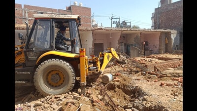 MC demolishes eight under construction illegal industrial/commercial buildings in Ludhiana on Friday. (HT Photo)