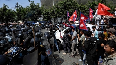 Pro-monarchy demonstrators scuffle with Nepal police during a protest to demand a Hindu state, in Kathmandu (AFP) Pro-monarchy demonstrators scuffle with Nepal police during a protest to demand a Hindu state, in Kathmandu (AFP)