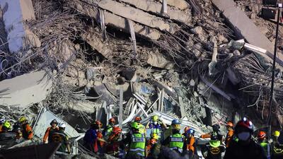 Rescue personnel work at the site of a building that collapsed after a strong earthquake struck central Myanmar on Friday. At least 25 tourists from various parts of Maharashtra, who are currently visiting Thailand, have been confirmed safe following the earthquake that struck parts of Myanmar and Thailand. (REUTERS)