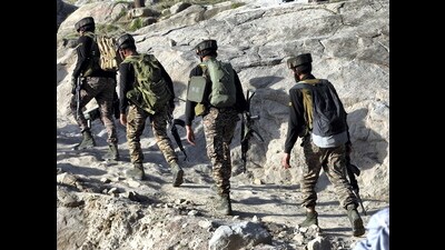 Security personnel patrol a remote forested area, in Kathua district, on Friday. (PTI) Security personnel patrol a remote forested area, in Kathua district, on Friday. (PTI)