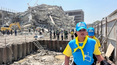 Thai King's volunteers work near the site of a collapsed building after a strong earthquake struck central Myanmar on Friday, earthquake monitoring services said, which affected Bangkok as well with hundreds of people pouring out of buildings in the Thai capital in panic after the tremors, in Bangkok, Thailand, March 28, 2025. (REUTERS)