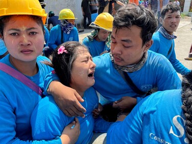 A worker reacts after the tremors of a strong earthquake that struck central Myanmar on Friday affected Bangkok, Thailand, (REUTERS)
