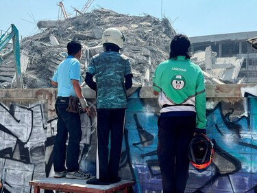 People look at the site of a collapsed building after the tremors of a strong earthquake that struck central Myanmar on Friday affected Bangkok, Thailand on March 28, 2025. (REUTERS)