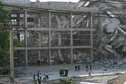Rescue workers look at the debris of a construction site after a building collapsed in Bangkok on March 28, 2025, following an earthquake. (AFP) Rescue workers look at the debris of a construction site after a building collapsed in Bangkok on March 28, 2025, following an earthquake. (AFP)