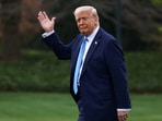 US President Donald Trump waves as he walks before departing for Florida from the South Lawn at the White House in Washington, D.C., U.S., March 28, 2025. 