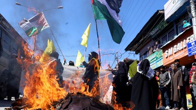 People burn an effigy during a procession to show solidarity with Palestine on Quds Day, an annual pro-Palestinian event during the last Friday of the ongoing Ramadan month, in Budgam on Friday. (ANI) People burn an effigy during a procession to show solidarity with Palestine on Quds Day, an annual pro-Palestinian event during the last Friday of the ongoing Ramadan month, in Budgam on Friday. (ANI)