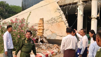 In this image provided by The Myanmar Military True News Information Team, Myanmar's military leader Senior Gen. Min Aung Hlaing, center, inspects damaged buildings caused by an earthquake Friday, in Naypyitaw. (AP) In this image provided by The Myanmar Military True News Information Team, Myanmar's military leader Senior Gen. Min Aung Hlaing, center, inspects damaged buildings caused by an earthquake Friday, in Naypyitaw. (AP)
