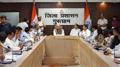 Union minister Rao Inderjit Singh with district officials at the Gurugram Mini Secretariat. (Parveen Kumar/HT)