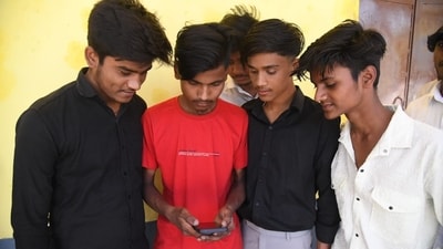 Students checking Bihar Board class 10th matric examination results on mobile at DAV high school Danapur in Patna. (Santosh Kumar ) Students checking Bihar Board class 10th matric examination results on mobile at DAV high school Danapur in Patna. (Santosh Kumar )