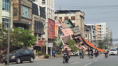Multiple aftershocks also jolted Myanmar, one of magnitude 6.4, after the first massive earthquake. In pic: People ride motorcycles past a damaged building after a strong earthquake struck central Myanmar, in Mandalay, Myanmar, March 28.  (REUTERS)