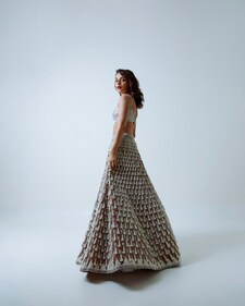 Manushi is enchanting in a Piroi lehenga adorned with intricate pearl work from Vvani by Vani Vats. Manushi is enchanting in a Piroi lehenga adorned with intricate pearl work from Vvani by Vani Vats.
