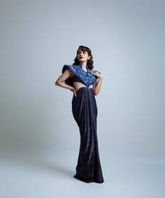 The actor looks breathtaking in a Nature-inspired ensemble featuring a drape gown with peacock feather motifs, adorned with sequins, and enhanded with structured shoulders, and cut out details at the waist. Her look is further elevated by Zambian emerald cascade diamond ear cuffs and statement diamond earrings. The actor looks breathtaking in a Nature-inspired ensemble featuring a drape gown with peacock feather motifs, adorned with sequins, and enhanded with structured shoulders, and cut out details at the waist. Her look is further elevated by Zambian emerald cascade diamond ear cuffs and statement diamond earrings.
