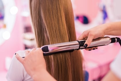 Heat is added to create desired hairstyle. (Freepik) Heat is added to create desired hairstyle. (Freepik)