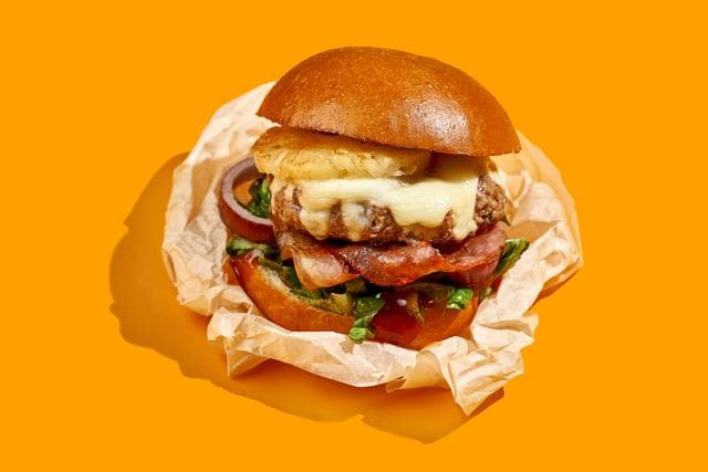 There is still a little grease paper in a lot of food packaging: look closely at the wraps around your burgers, fries and sandwiches. (Adobe Stock) There is still a little grease paper in a lot of food packaging: look closely at the wraps around your burgers, fries and sandwiches. (Adobe Stock)