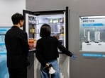 Attendees look at a Samsung Electronics Co. AI refrigerator during the company's Bespoke AI event in Seoul, South Korea, on Friday, March 28, 2025. Samsung pledged to strengthen its position in the high-bandwidth memory chip market this year, in response to shareholder criticism over its underperformance in the lucrative artificial intelligence arena. Attendees look at a Samsung Electronics Co. AI refrigerator during the company's Bespoke AI event in Seoul, South Korea, on Friday, March 28, 2025. Samsung pledged to strengthen its position in the high-bandwidth memory chip market this year, in response to shareholder criticism over its underperformance in the lucrative artificial intelligence arena.