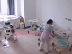 Two nurses at the maternity ward of Jingcheng Hospital in Yunnan province try holding the creches of newborns. Two nurses at the maternity ward of Jingcheng Hospital in Yunnan province try holding the creches of newborns.