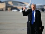 US President Donald Trump pumps his fist as he walks to board Air Force One at Joint Base Andrews in Maryland.