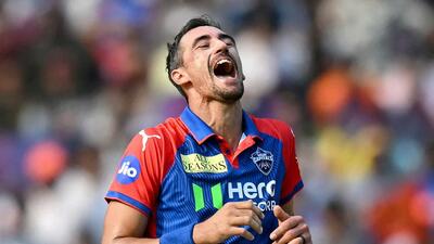Delhi Capitals's Mitchell Starc celebrates after taking the wicket of Sunrisers Hyderabad's Travis Head. (AFP) Delhi Capitals's Mitchell Starc celebrates after taking the wicket of Sunrisers Hyderabad's Travis Head. (AFP)