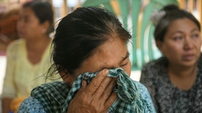A woman reacts while waiting during search and rescue operations at a damaged temple in Mandalay on March 30, 2025, two days after an earthquake struck central Myanmar. Many of Mandalay's 1.5 million people spent the night sleeping on the streets. (AFP) A woman reacts while waiting during search and rescue operations at a damaged temple in Mandalay on March 30, 2025, two days after an earthquake struck central Myanmar. Many of Mandalay's 1.5 million people spent the night sleeping on the streets. (AFP)