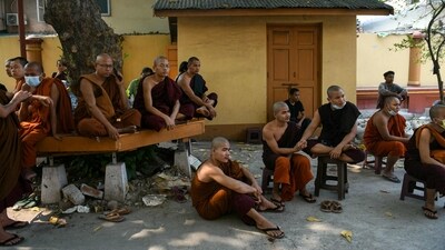 Monks wait during search and rescue operations at a damaged temple in Mandalay on March 30, 2025. Many religious structures have been damaged due to the earthquake. (AFP) Monks wait during search and rescue operations at a damaged temple in Mandalay on March 30, 2025. Many religious structures have been damaged due to the earthquake. (AFP)