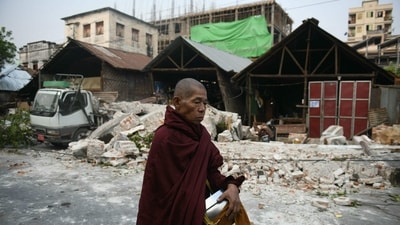 A monk walks past damaged houses in Mandalay on March 30, 2025, two days after an earthquake struck central Myanmar. (AFP) A monk walks past damaged houses in Mandalay on March 30, 2025, two days after an earthquake struck central Myanmar. (AFP)