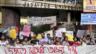 Students protest outside the Jadavpur University campus in Kolkata. (PTI Photo) Students protest outside the Jadavpur University campus in Kolkata. (PTI Photo)