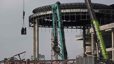 Rescue workers are lifted on a crane towards the top of the rubble at the site of an under-construction building collapse in Bangkok on March 30, 2025. Rescuers continued to dig through the rubble of collapsed buildings in a desperate search for survivors. (AFP) Rescue workers are lifted on a crane towards the top of the rubble at the site of an under-construction building collapse in Bangkok on March 30, 2025. Rescuers continued to dig through the rubble of collapsed buildings in a desperate search for survivors. (AFP)