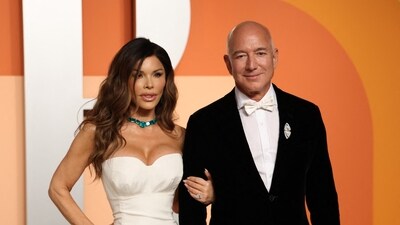 CEO of Amazon Jeff Bezos and partner Lauren Sanchez attend the Vanity Fair Oscar Party at the Wallis Annenberg Center for the Performing Arts in Beverly Hills, California, on March 2, 2025. (Photo by Michael Tran / AFP) (AFP) CEO of Amazon Jeff Bezos and partner Lauren Sanchez attend the Vanity Fair Oscar Party at the Wallis Annenberg Center for the Performing Arts in Beverly Hills, California, on March 2, 2025. (Photo by Michael Tran / AFP) (AFP)
