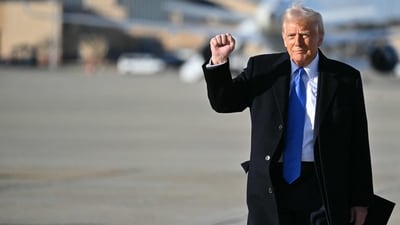 US President Donald Trump pumps his fist as he walks to board Air Force One at Joint Base Andrews in Maryland. (AFP file photo)