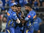 Mumbai Indians' Ashwani Kumar (C) celebrates with his captain Hardik Pandya (R) and teammate Suryakumar Yadav. Mumbai Indians' Ashwani Kumar (C) celebrates with his captain Hardik Pandya (R) and teammate Suryakumar Yadav.